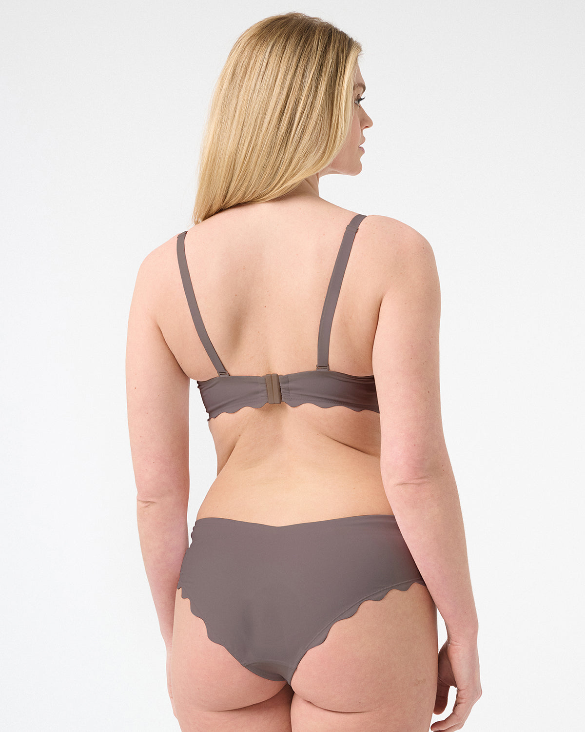 Back of woman wearing brown balconette swimsuit