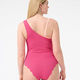 Back of a woman wearing pink one piece swimsuit