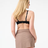 Back of a person wearing a black swim top and a brown swim sarong wrapped around the waist.