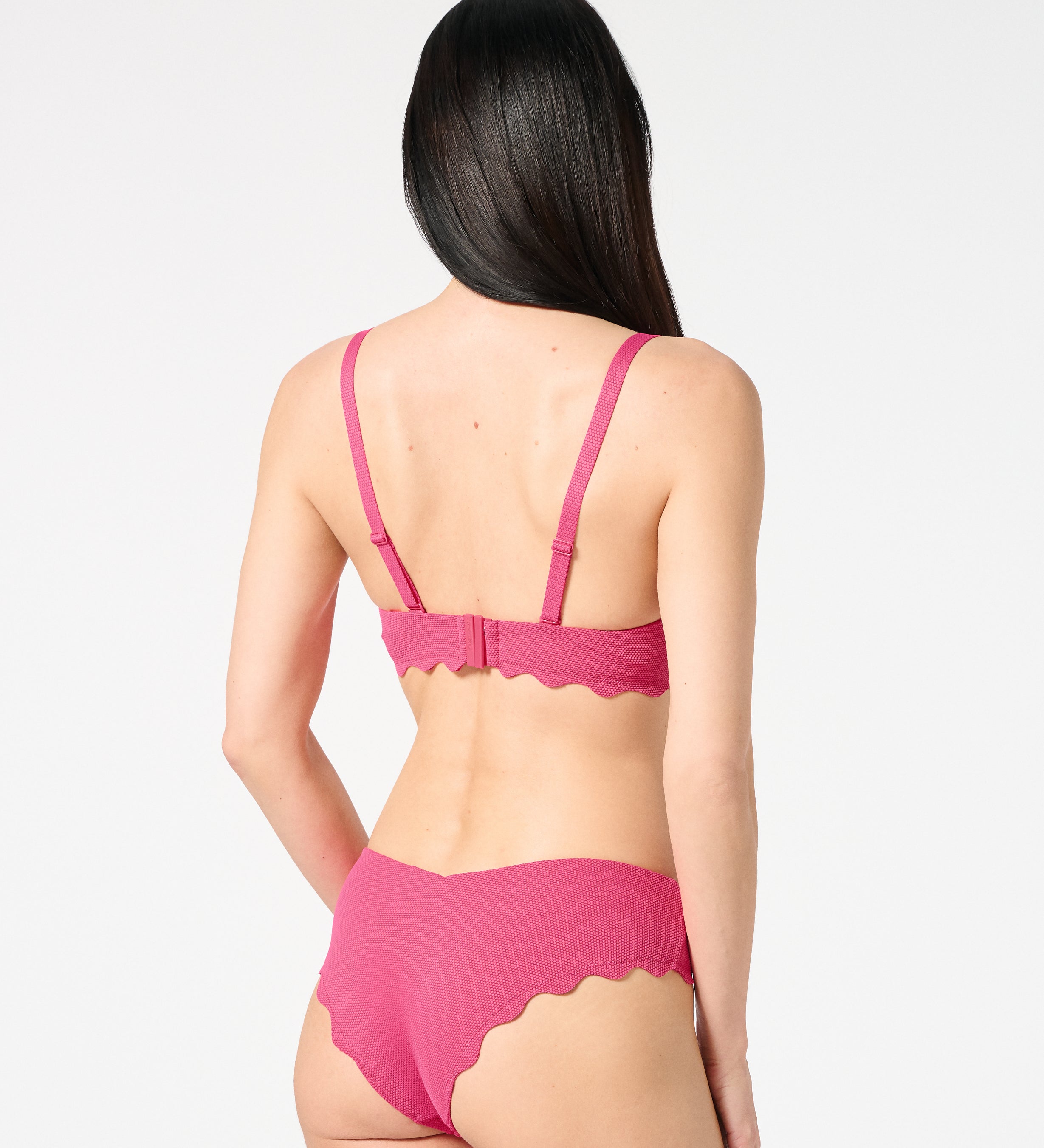 Back view of textured Hibiscus balconette bikini set with supportive closure and flattering scalloped bikini bottoms