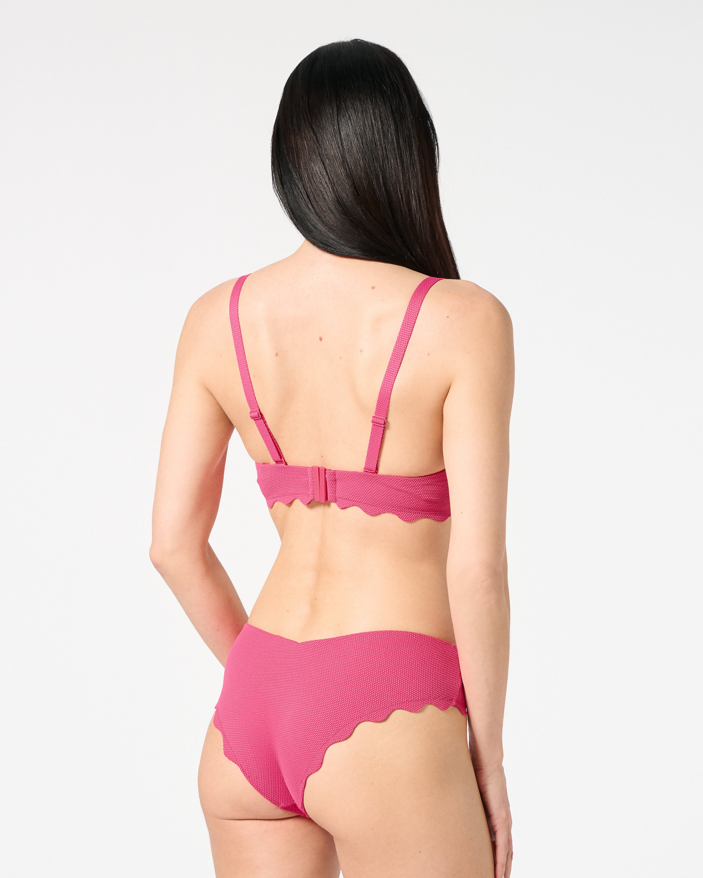 Back view of textured Hibiscus balconette bikini set with supportive closure and flattering scalloped bikini bottoms