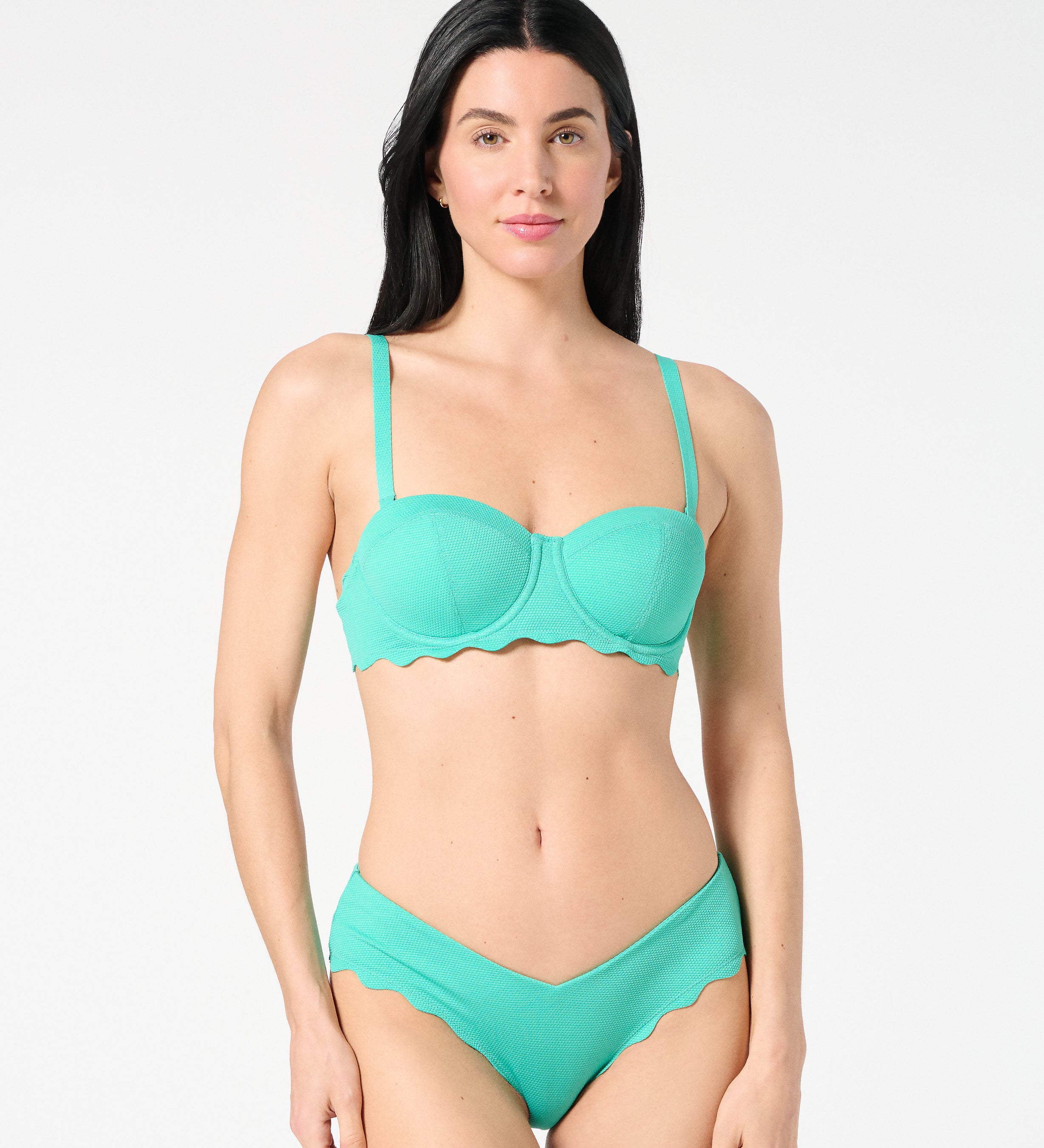 Front view of woman wearing Siren + Sage Goddess Balconette Bikini Top and Iris Bikini Bottoms in Deep Dive textured Italian fabric, showing supportive balconette fit and sculpting coverage