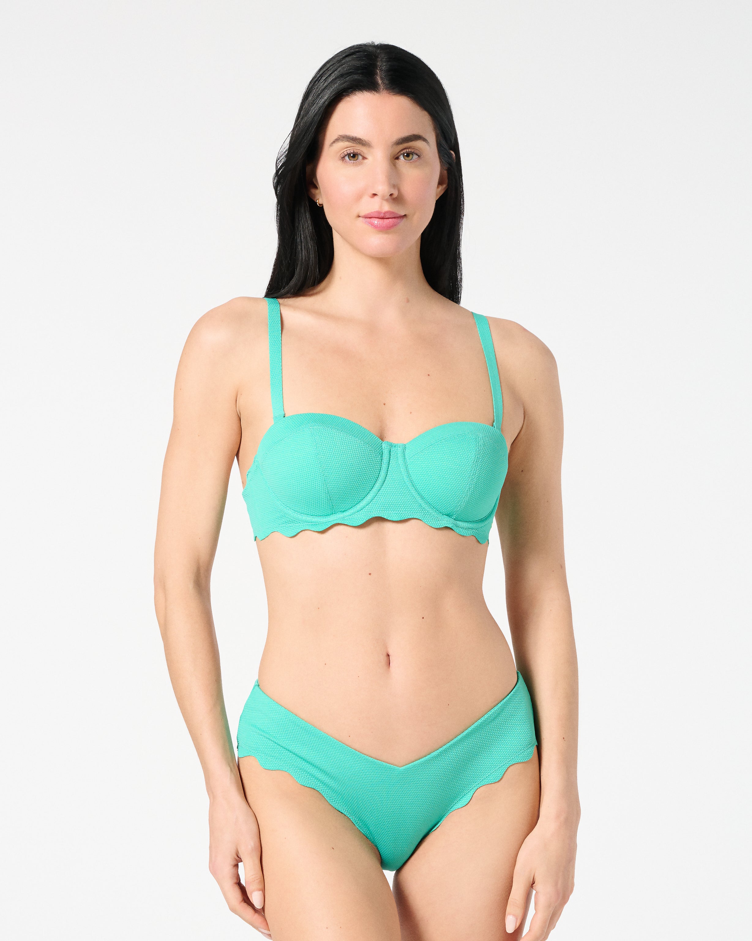 Front view of woman wearing Siren + Sage Goddess Balconette Bikini Top and Iris Bikini Bottoms in Deep Dive textured Italian fabric, showing supportive balconette fit and sculpting coverage