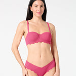 Front view of woman wearing textured Hibiscus balconette bikini top and scalloped bikini bottoms — supportive, bra-sized swim set