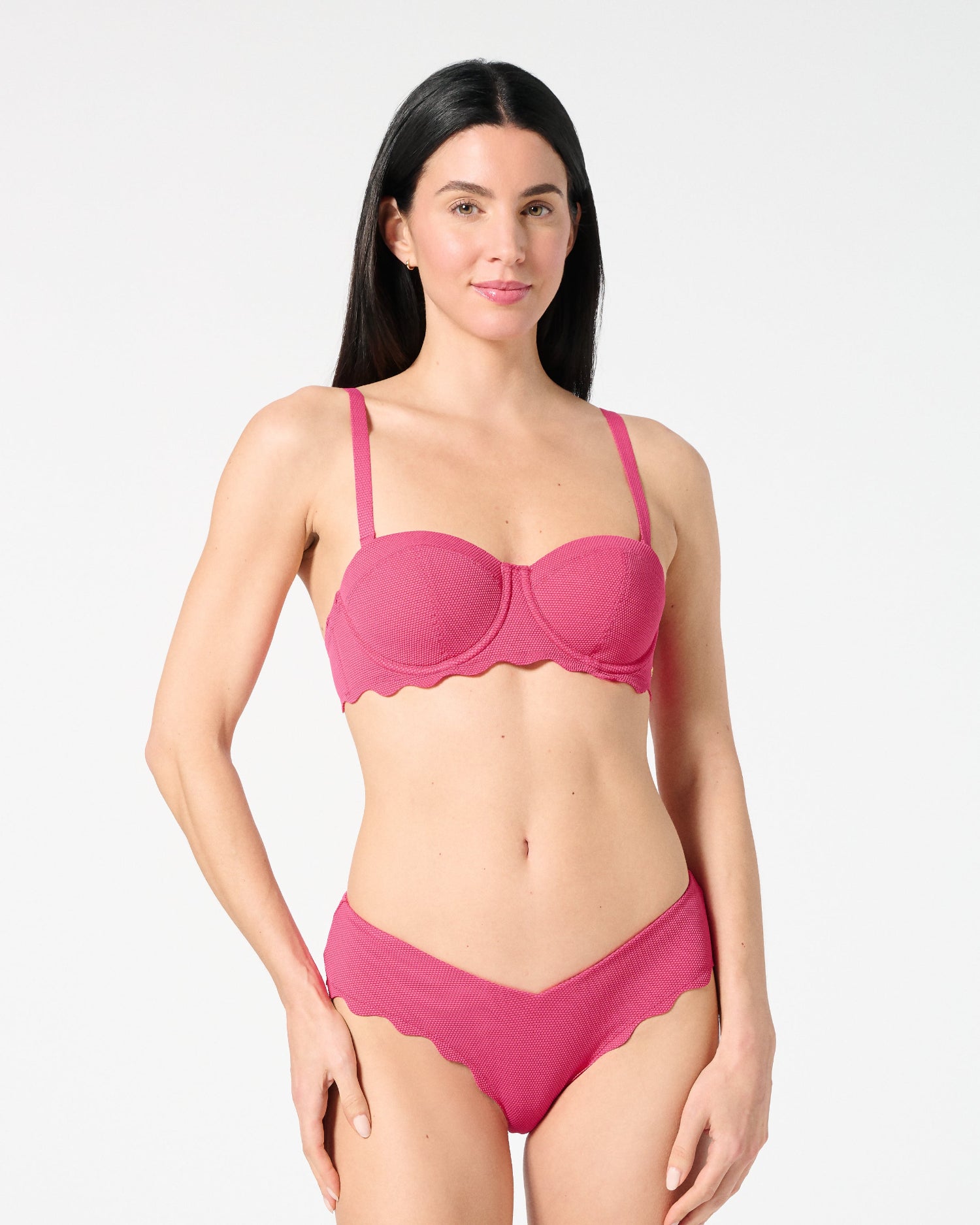 Front view of woman wearing textured Hibiscus balconette bikini top and scalloped bikini bottoms — supportive, bra-sized swim set