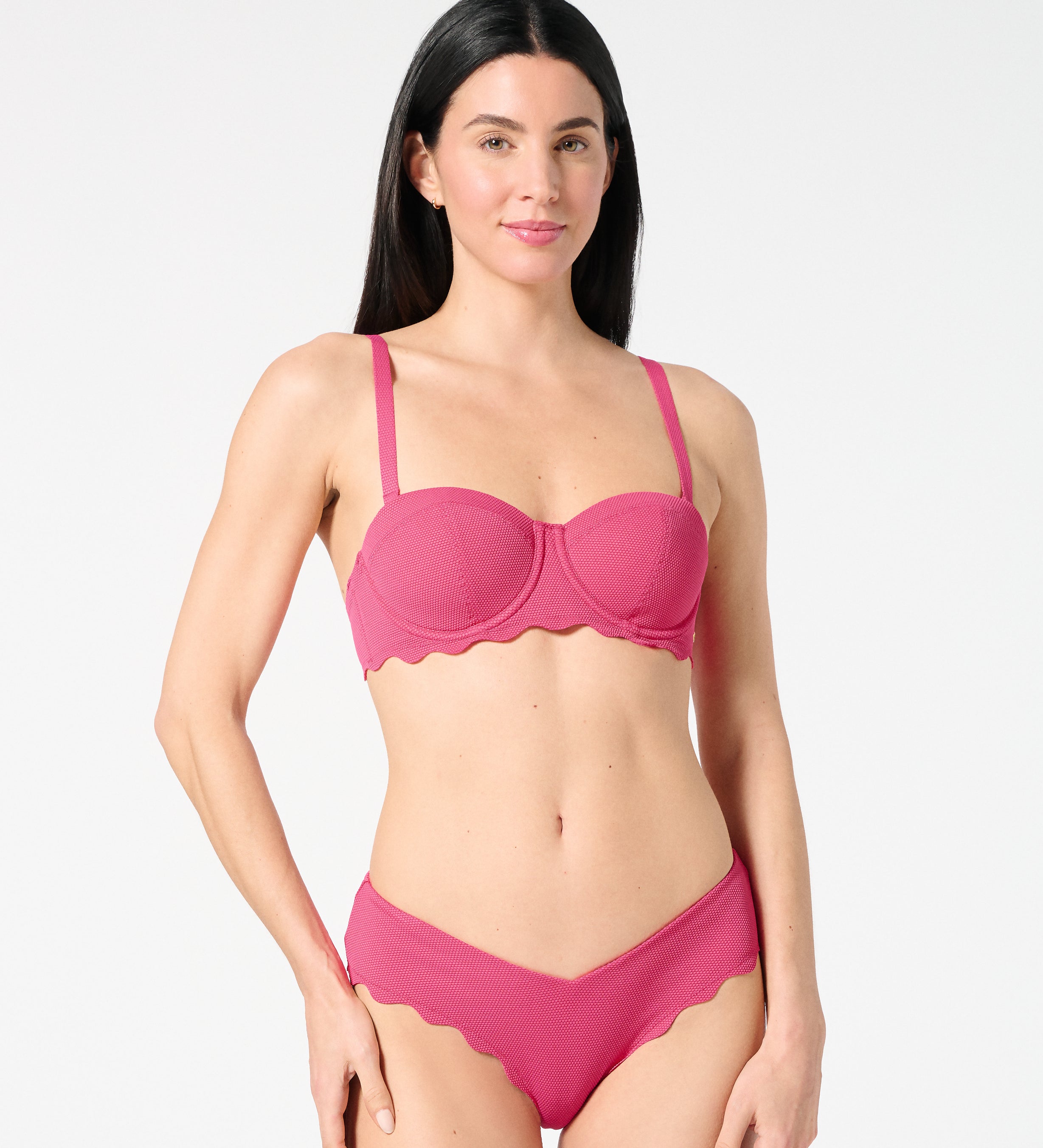 Front view of woman wearing textured Hibiscus balconette bikini top and scalloped bikini bottoms — supportive, bra-sized swim set