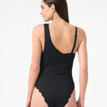 Woman wearing black one piece swimsuit 