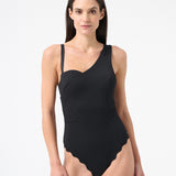 Woman wearing black one piece swimsuit 