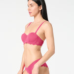 Side view of textured Hibiscus balconette bikini top and scalloped bikini bottoms, featuring a smooth sculpting fit in a vibrant color