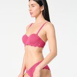 Side view of textured Hibiscus balconette bikini top and scalloped bikini bottoms, featuring a smooth sculpting fit in a vibrant color