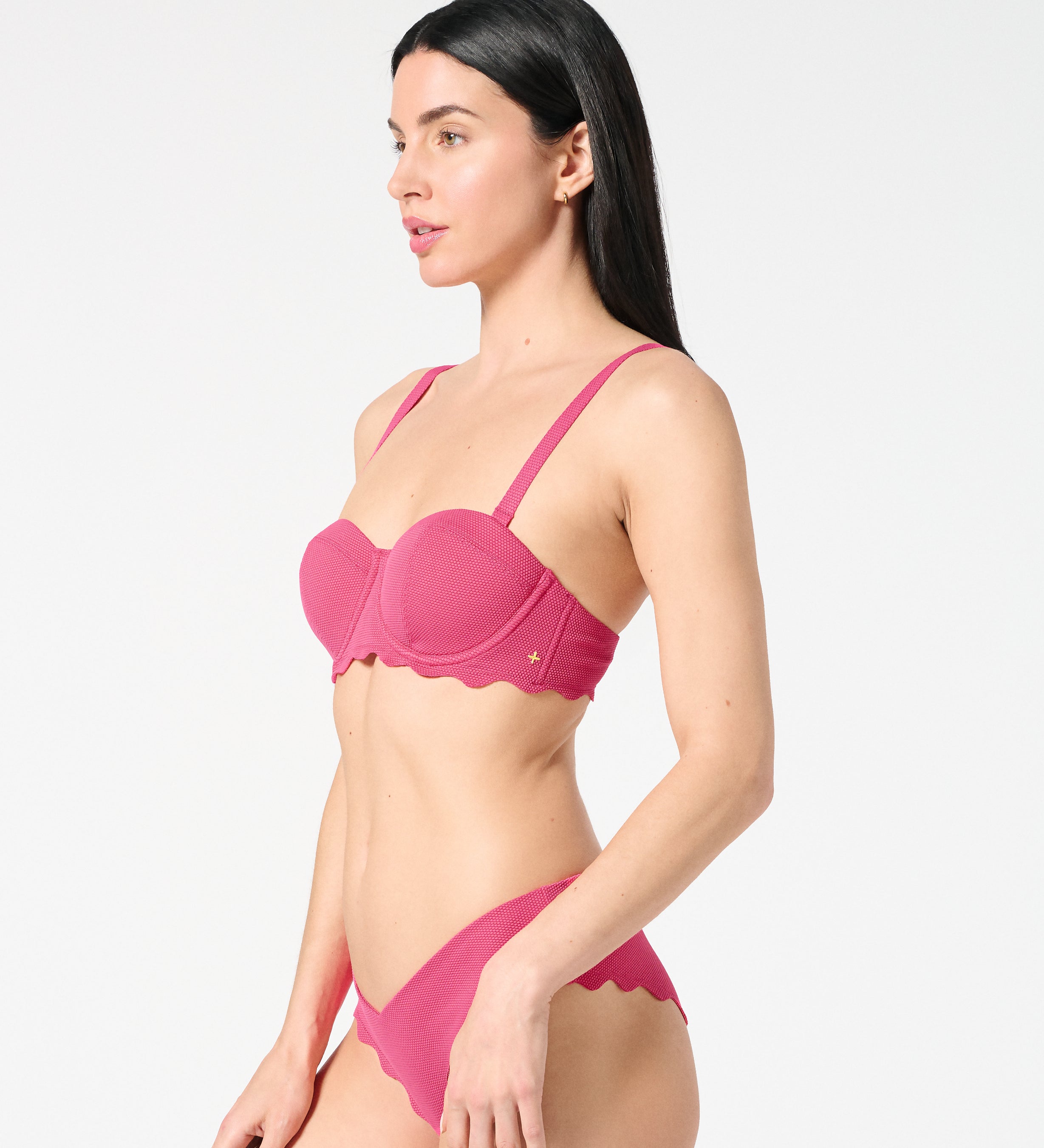 Side view of textured Hibiscus balconette bikini top and scalloped bikini bottoms, featuring a smooth sculpting fit in a vibrant color