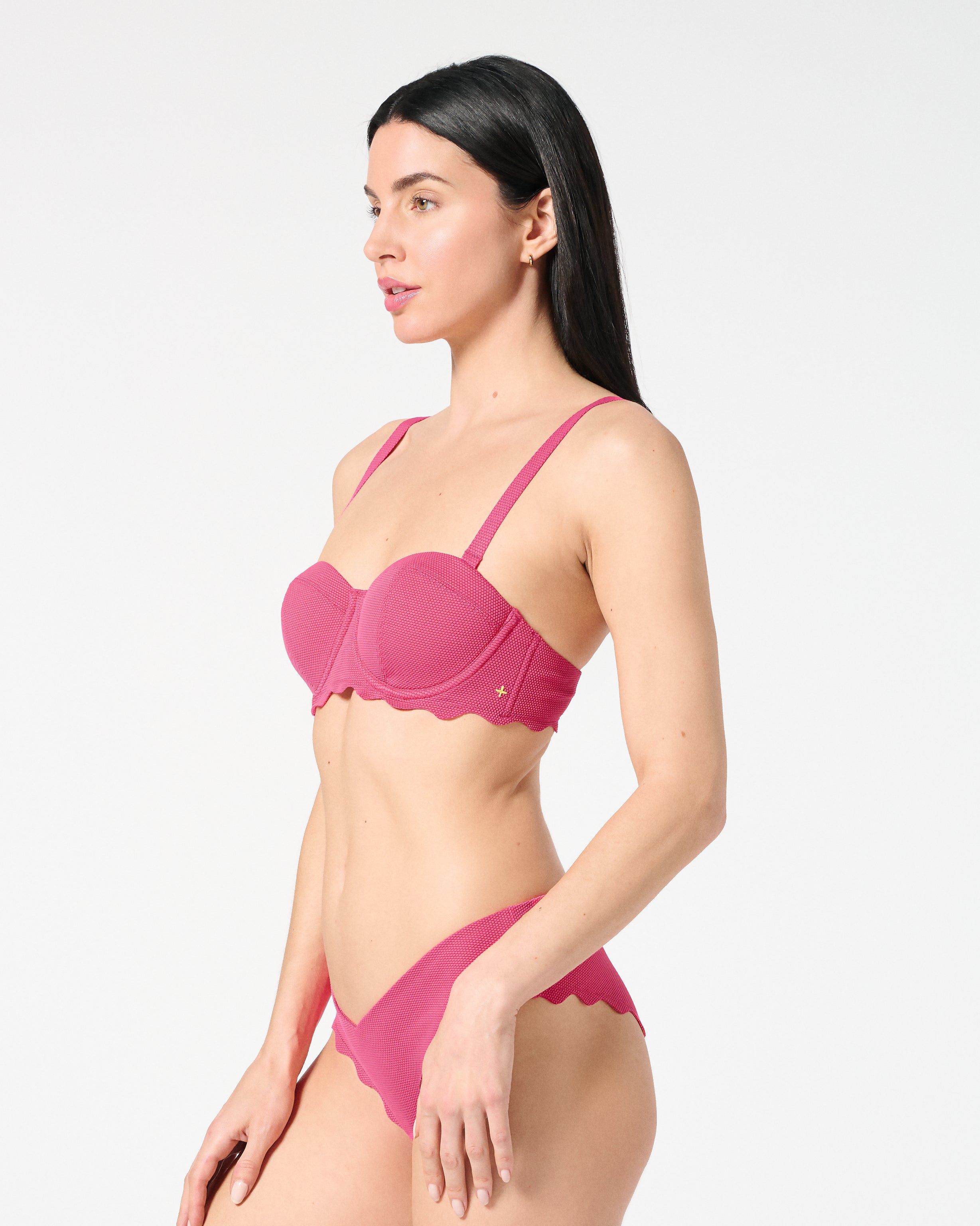 Side view of textured Hibiscus balconette bikini top and scalloped bikini bottoms, featuring a smooth sculpting fit in a vibrant color